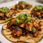 Close up of Tostadas with Chicken Guacamole and Beans